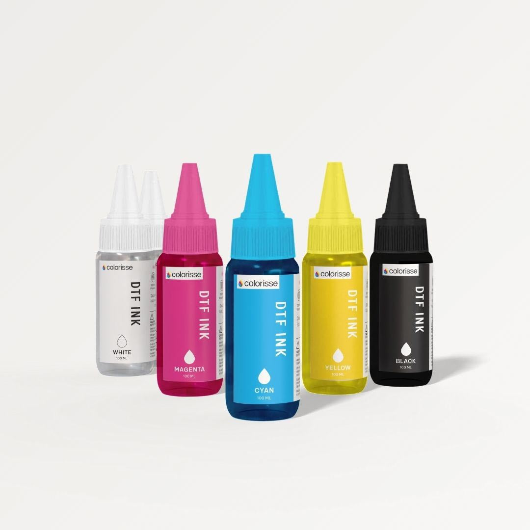 Colorisse 100ml DTF ink bottles in assorted colors for precise, vibrant printing on custom designs.
